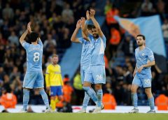 Manchester City's Riyad Mahrez applauds fans after the match.