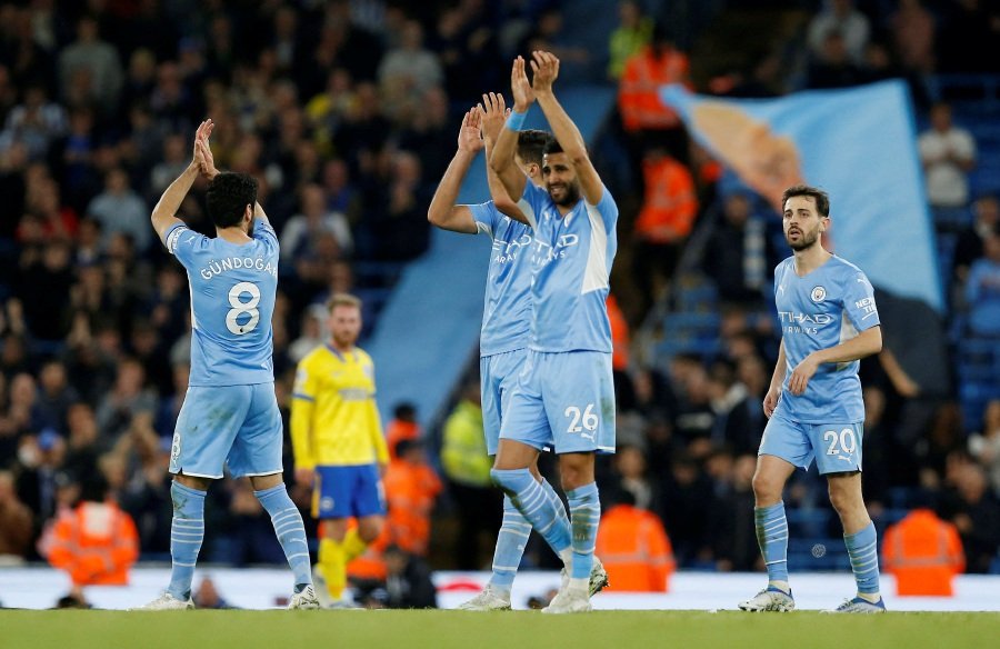 Manchester City's Riyad Mahrez applauds fans after the match.