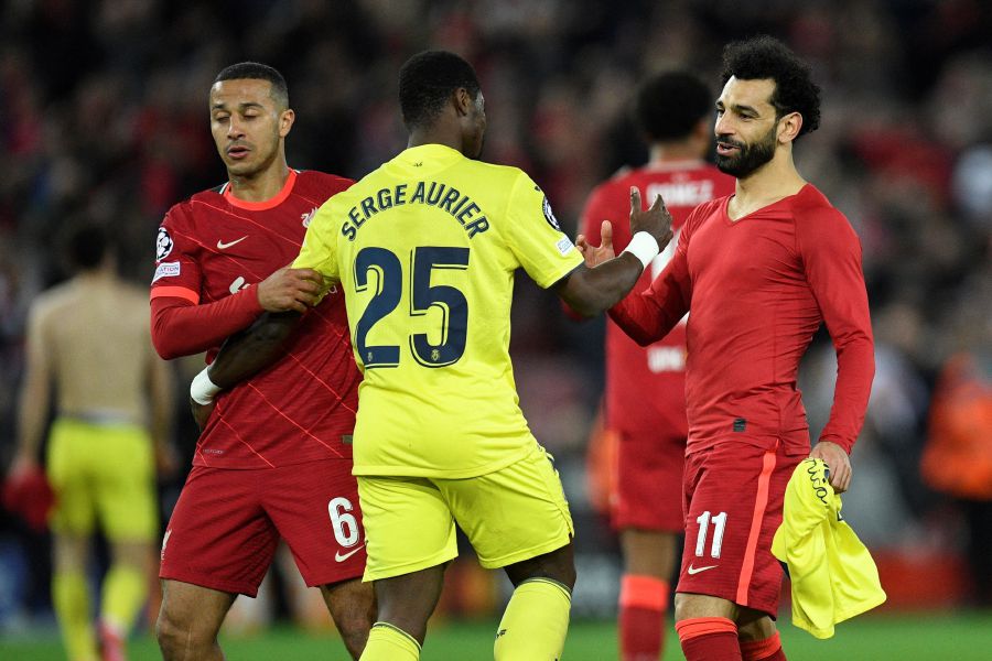 Liverpool's Egyptian midfielder Mohamed Salah and Villarreal's Ivorian defender Serge Aurier congratulate each other at the end of the UEFA Champions League semi-final first leg football match between Liverpool and Villarreal, at the Anfield Stadium, in Liverpool.