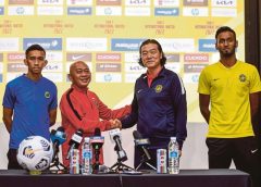 National coach Kim Pan Gon (right) and his Brunei counterpart, Rosanan Samak at a press conference at Wisma FAM in Kelana Jaya yesterday.