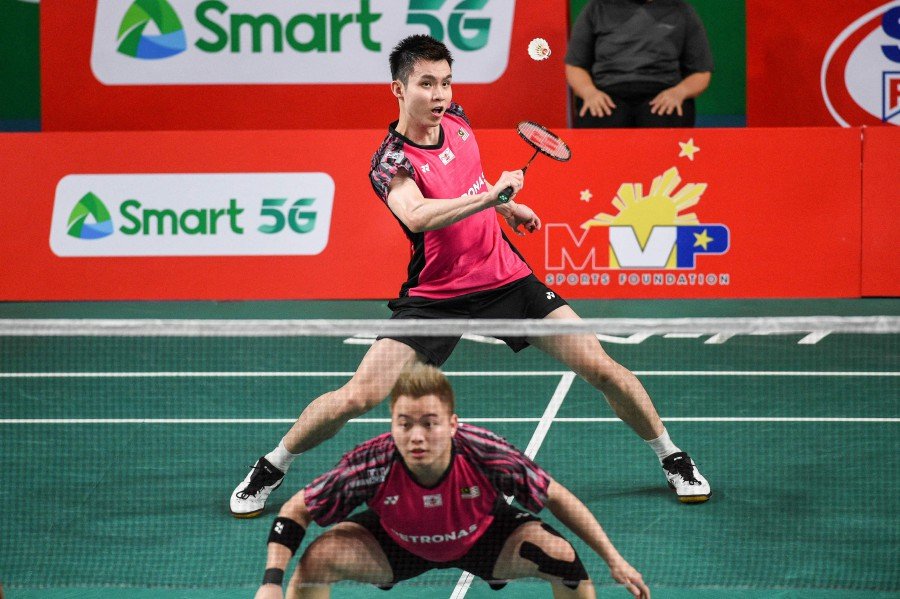 Aaron Chia (top) and Soh Wooi Yik play against Indonesia's Pramudya Kusumawardana and Yeremia Erich Yoche Yacob Rambitan during their men's doubles finals match at the Badminton Asia Championships in Muntinlupa, suburban Manila.