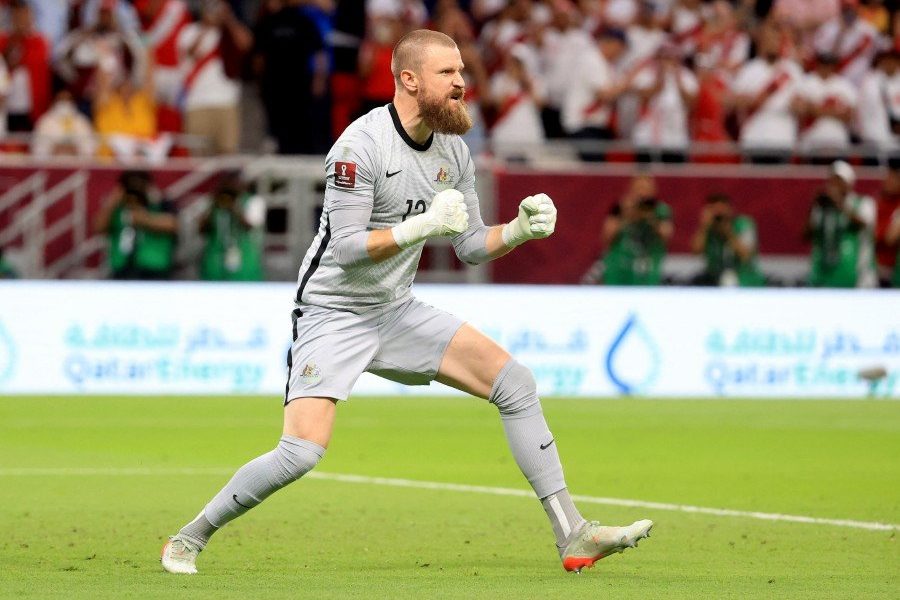 Australia's Andrew Redmayne celebrates after saving a penalty during the shootout against Peru at Al Rayyan Stadium, Al Rayyan, Qatar